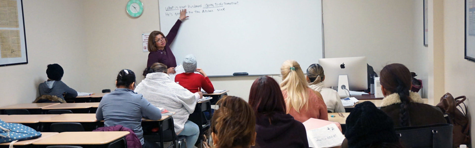 Adult Learning Center Classroom Wide Shot with Instructor Pointing