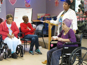 Lucille St. Bernard, seated right, read about the first black female secretary of state, Condoleezza Rice.