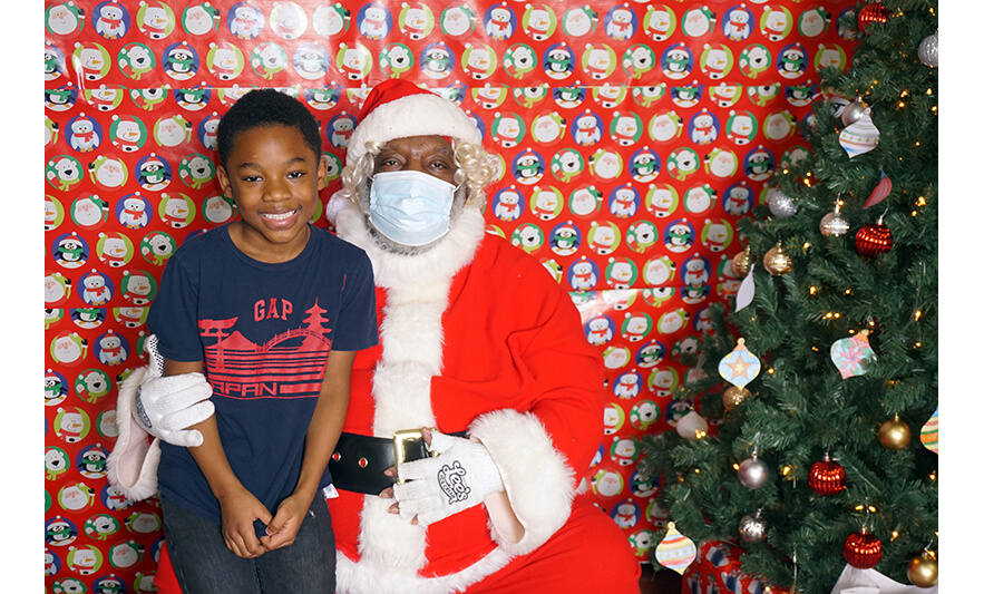 Breakfast with Santa 12-17-2022 Boy in Gap shirt with Santa for web