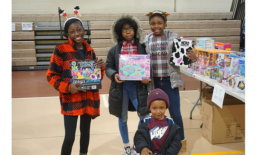 Breakfast with Santa 12-17-2022 Four kids with gifts for web