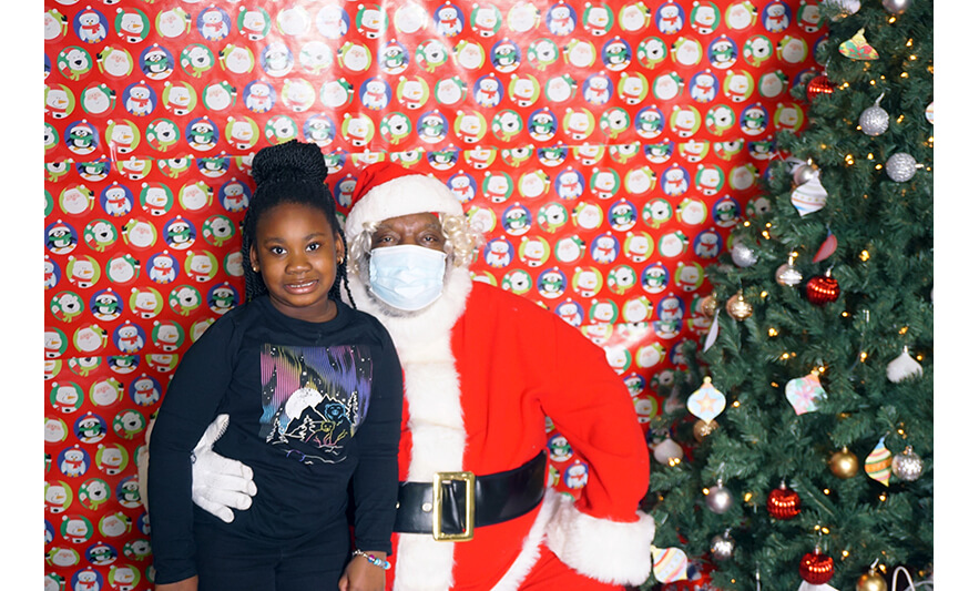 Breakfast with Santa 12-17-2022 Girl in black with Santa for web