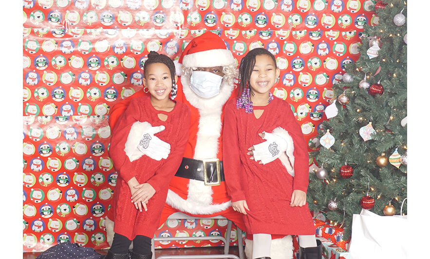 Breakfast with Santa 12-17-2022 Girls in sweater dresses with Santa for web