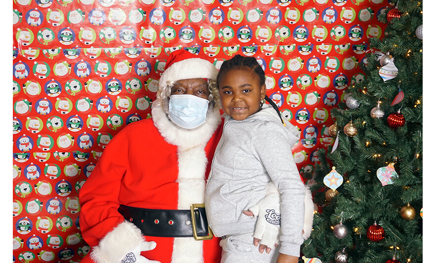 Breakfast with Santa 12-17-2022 Santa with girl in gray for web