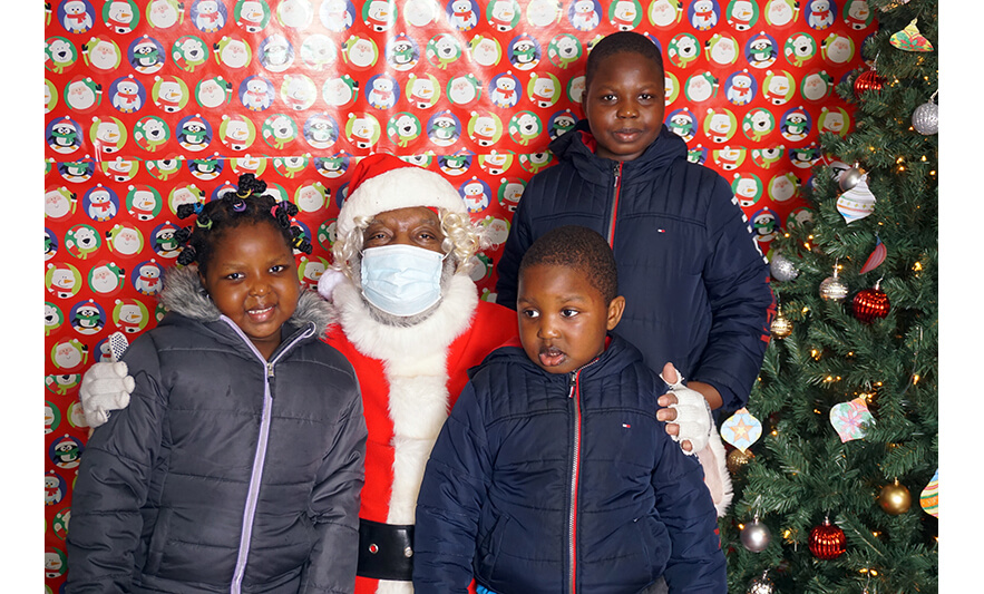 Breakfast with Santa 12-17-2022 Trio in coats with Santa for web