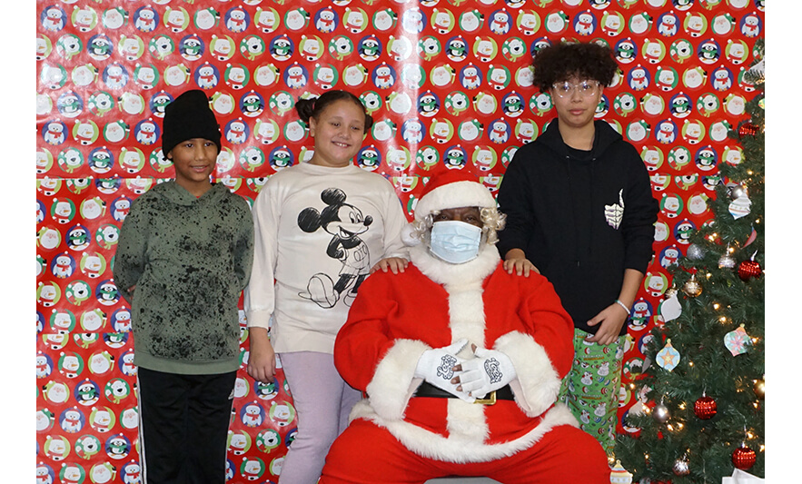 Breakfast with Santa 12-17-2022 Trio in sweatshirts with Santa for web