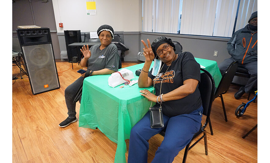 Commons Senior Christmas Luncheon 12-6-2022 Pair waving for web