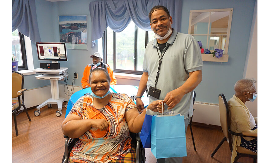 Extended Care Adopt-a-Resident Day 5-15-2024 Nelson Gibson with woman in orange for web