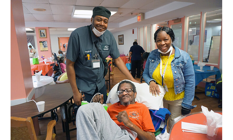 Extended Care Adopt-a-Resident Day 5-15-2024 Reginald and Yonette Semple with resident for web