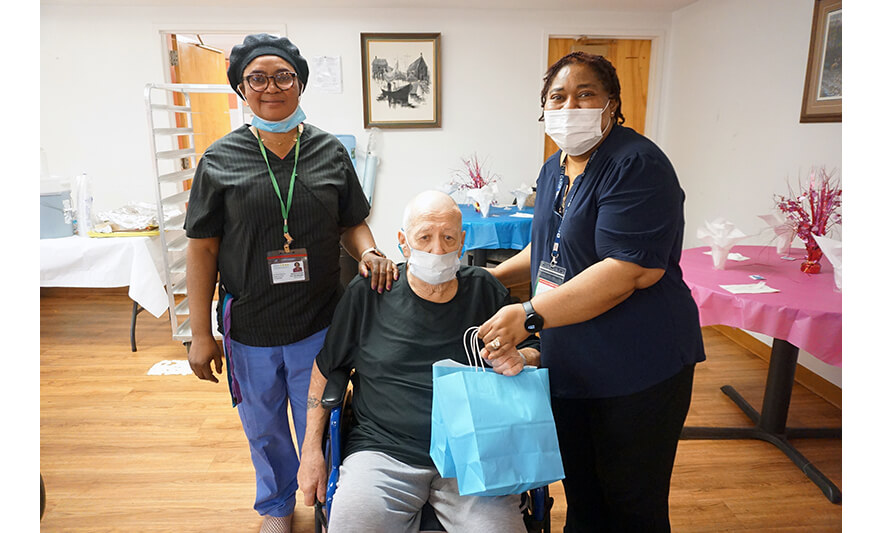 Extended Care Adopt-a-Resident Day 5-15-2024 Staff with man in black shirt for web