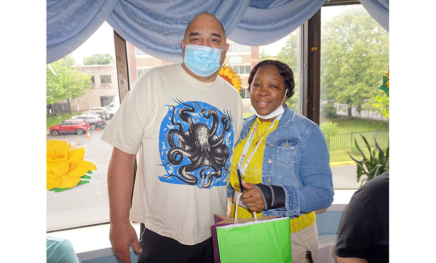 Extended Care Adopt-a-Resident Day 5-15-2024 Yonette Semple with man in octopus shirt for web
