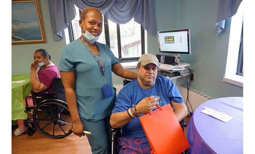 Extended Care Adopt-a-Resident Day 5-15-2025 Man in blue for web