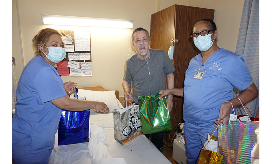 Extended Care Adopt-A-Resident Day 5-17-2023 Housekeeping staff with man in gray for web