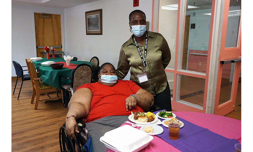Extended Care Adopt-A-Resident Day 5-17-2023 Julienne Van-Nooten with woman in red for web