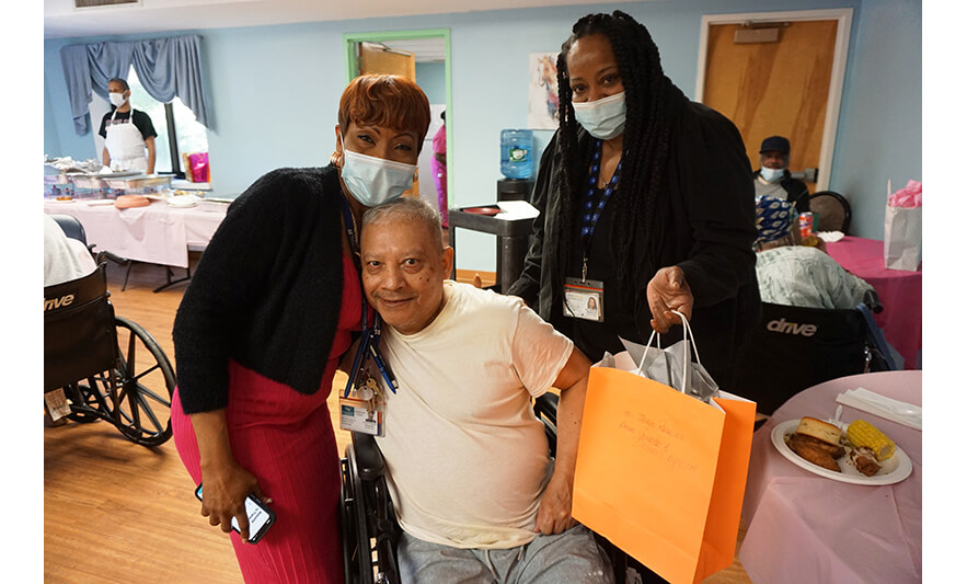 Extended Care Adopt-A-Resident Day 5-17-2023 Veronica Onwunaka and Delores Bynum with man for web