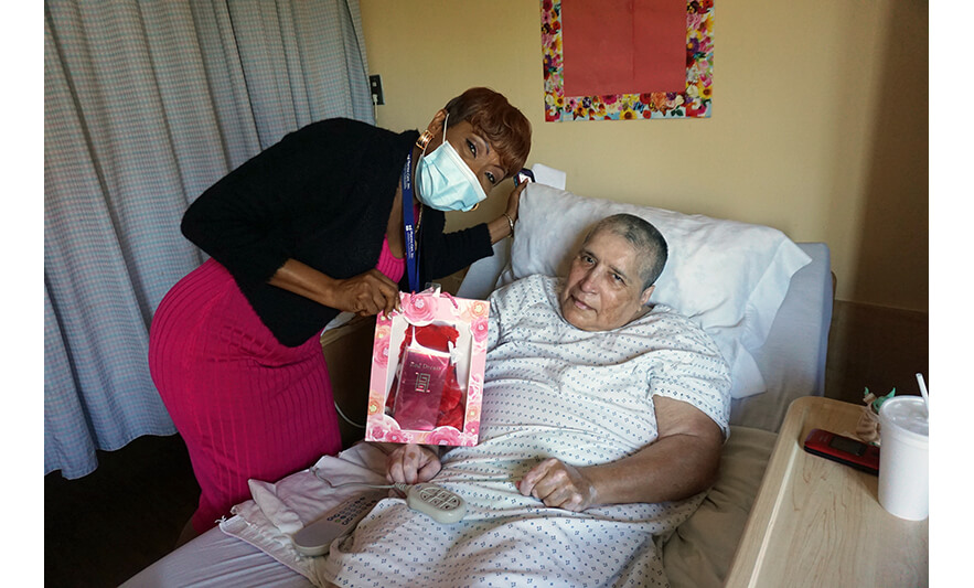 Extended Care Adopt-A-Resident Day 5-17-2023 Veronica Onwunaka with woman in room for web