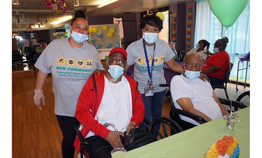 Extended Care Cookout 5-19-2023 Two men with staff for web