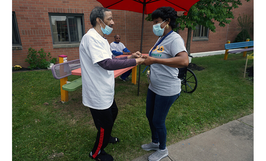 Extended Care Cookout 5-19-2023 Veronica Onwunaka dancing with resident for web
