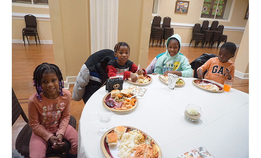 Withum Harmony House Thanksgiving Dinner 11-21-2022 Four kids at table for web